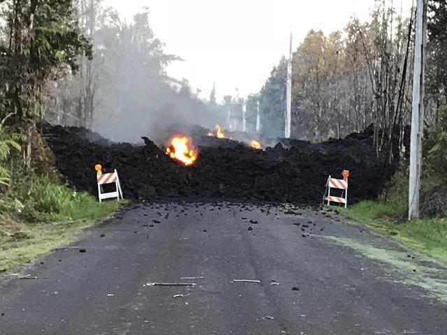 Mohala Street in Leiliani Estates near the town of Pahoa is blocked by a lava flow from the eruption of Kilauea volcano. (Hawaii Electric Light via AP Photo ) Mohala Street in Leiliani Estates near the town of Pahoa is blocked by a lava flow from the eruption of Kilauea volcano. (Hawaii Electric Light via AP Photo )