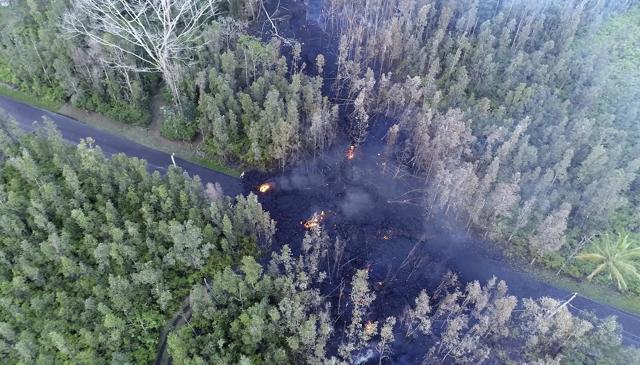 In this still frame taken from video, lava flows over a road in the Puna District as a result of the eruption from Kilauea Volcano on Hawaii's Big Island Friday, May 4, 2018. (AP Photo) In this still frame taken from video, lava flows over a road in the Puna District as a result of the eruption from Kilauea Volcano on Hawaii's Big Island Friday, May 4, 2018. (AP Photo)