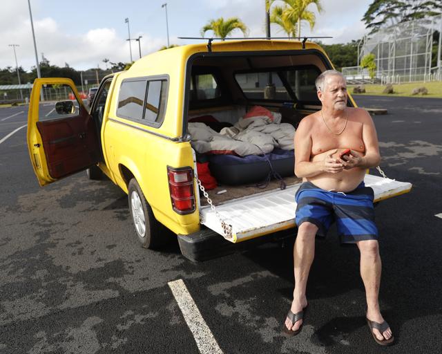 After being forced out of his home at the Leilani Estates due to a mandatory evacuation, Tim Sullivan, 61, sits in his pickup truck near a local shelter, Friday, May 4, 2018, in Pahoa, HI. (AP Photo) After being forced out of his home at the Leilani Estates due to a mandatory evacuation, Tim Sullivan, 61, sits in his pickup truck near a local shelter, Friday, May 4, 2018, in Pahoa, HI. (AP Photo)