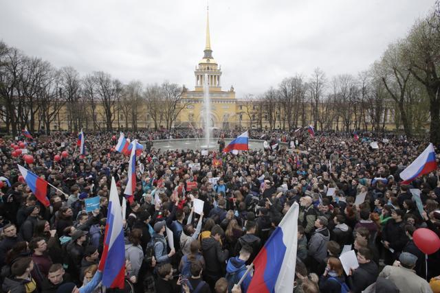 Protesters attend a rally in St Petersburg, Russia, on Saturday. (AP) Protesters attend a rally in St Petersburg, Russia, on Saturday. (AP)