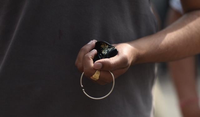 A student removes his metal jewellery before entering the NEET exam centre at Kerala School in Delhi. (Raj K Raj/HT Photo) A student removes his metal jewellery before entering the NEET exam centre at Kerala School in Delhi. (Raj K Raj/HT Photo)
