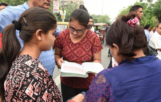 Students do last-minute revisions outside the NEET examination centre at Alhcon International School in Mayur Vihar, Delhi (Raj K Raj/HT Photo) Students do last-minute revisions outside the NEET examination centre at Alhcon International School in Mayur Vihar, Delhi (Raj K Raj/HT Photo)
