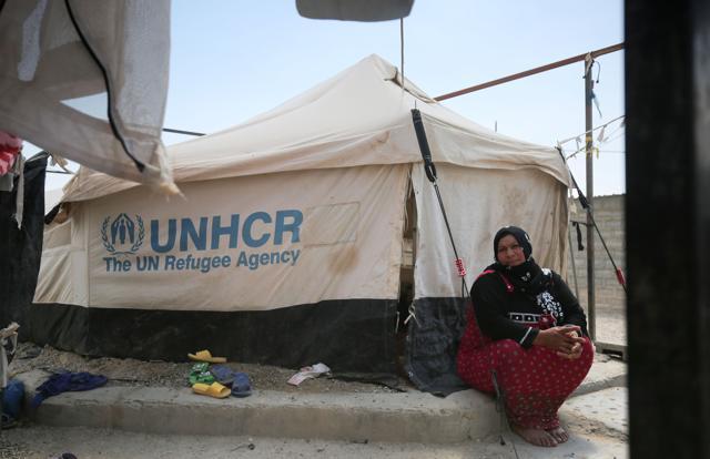 A displaced Iraqi woman sits outside a tent where she is taking shelter in a camp for internally displaced people near al-Khalidiyeh in Iraq's western Anbar province on April 24, 2018. (AFP) A displaced Iraqi woman sits outside a tent where she is taking shelter in a camp for internally displaced people near al-Khalidiyeh in Iraq's western Anbar province on April 24, 2018. (AFP)