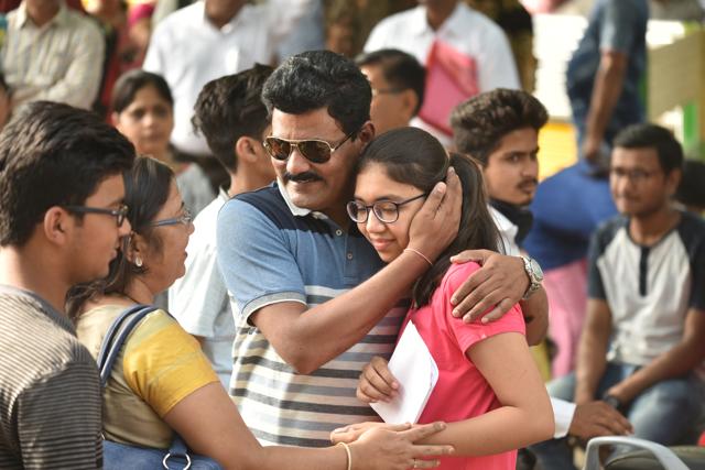Parents of a NEET candidate wish her luck before the entrance exam at the Jawaharlal Nehru School exam centre in Bhopal, MP. (Mujeeb Faruqui/HT Photo) Parents of a NEET candidate wish her luck before the entrance exam at the Jawaharlal Nehru School exam centre in Bhopal, MP. (Mujeeb Faruqui/HT Photo)