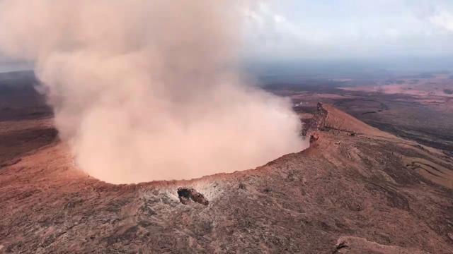 In this photo provided by Tulsi Gabbard, who is on active duty Hawaii National Guard deployment, ash from the Puu Oo vent on Kilauea volcano rises into the air, near Pahoa, Hawaii. (AP Photo)