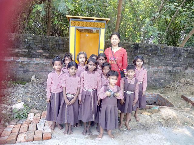 Monika Singh with liitle girls of primary school Cheda ka Purwa in Chinhat block where she got a toilet installed.