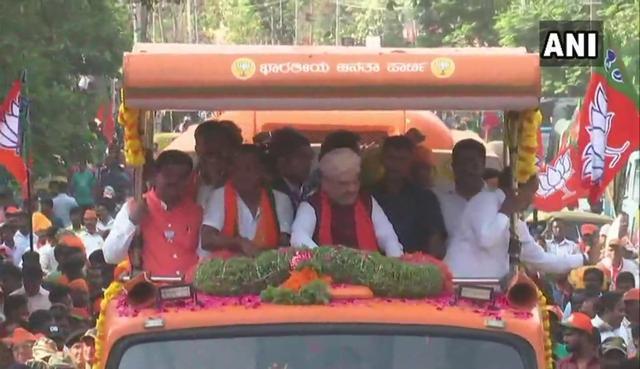 Amit Shah holds a road show in Bengaluru. (ANI/Twitter)
