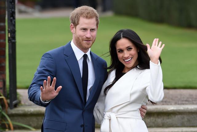 Prince Harry and Meghan Markle pose for the media in the grounds of Kensington Palace in London, after announcing their engagement. The couple will wed on May 19. (AP) Prince Harry and Meghan Markle pose for the media in the grounds of Kensington Palace in London, after announcing their engagement. The couple will wed on May 19. (AP)