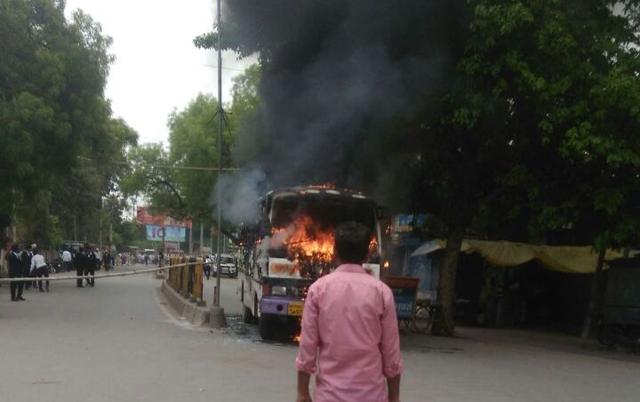 A bus set on fir near the district magistrate’s office in Kutchery road in Allahabad. (HT PHOTO) A bus set on fir near the district magistrate’s office in Kutchery road in Allahabad. (HT PHOTO)