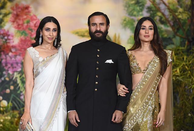 Karisma Kapoor (L), Saif Ali Khan (C) and Kareena Kapoor (R) pose for a picture during the wedding reception of actress Sonam Kapoor and businessman Anand Ahuja. (AFP) Karisma Kapoor (L), Saif Ali Khan (C) and Kareena Kapoor (R) pose for a picture during the wedding reception of actress Sonam Kapoor and businessman Anand Ahuja. (AFP)