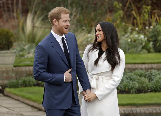 Britain's Prince Harry and fiancee Meghan Markle pose for photographers during a photocall in the grounds of Kensington Palace in London, marking the couple's engagement. (AP) Britain's Prince Harry and fiancee Meghan Markle pose for photographers during a photocall in the grounds of Kensington Palace in London, marking the couple's engagement. (AP)