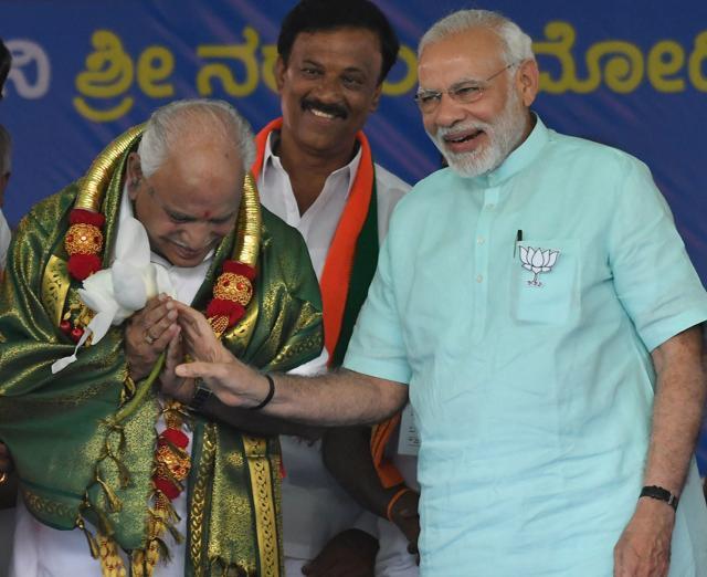 Prime Minister Narendra Modi and BJP's chief ministerial candidate BS Yeddyurappa while campaigning for Karnataka elections in Chamarajanagar on Tuesday. (PTI) Prime Minister Narendra Modi and BJP's chief ministerial candidate BS Yeddyurappa while campaigning for Karnataka elections in Chamarajanagar on Tuesday. (PTI)