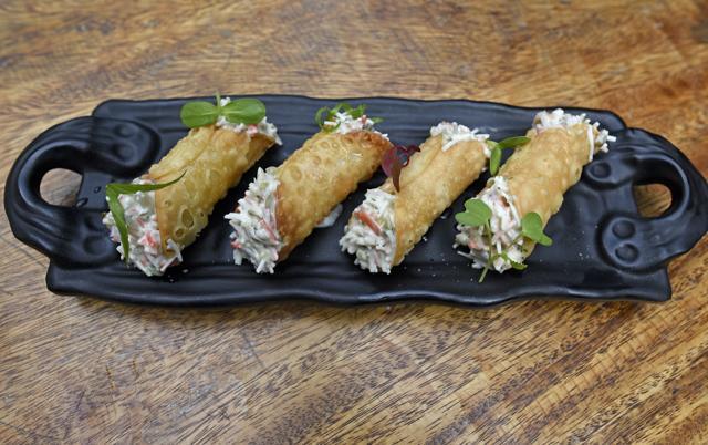 The Italy-meets-Thailand savoury cannolis, stuffed with kafir lime-laced crab meat and limoncello salt, should have had less of the processed crab stick and more of the real crustacean. (Satyabrata Tripathy / HT Photo)