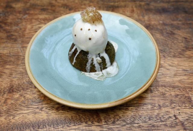 Our dessert — homemade chamomile ice-cream cushioned by a moist, fragrant pistachio cake, dusted with bee pollen and drizzled with honey — was a winner. (Satyabrata Tripathy/HT Photo)