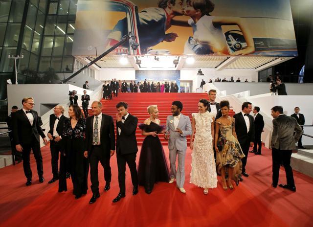Director Ron Howard poses with cast members Joonas Suotamo, Thandie Newton, Woody Harrelson, Emilia Clarke, Alden Ehrenreich, Donald Glover, Paul Bettany, Phoebe Waller-Bridge and producer Kathleen Kennedy after the Cannes screening. (REUTERS) Director Ron Howard poses with cast members Joonas Suotamo, Thandie Newton, Woody Harrelson, Emilia Clarke, Alden Ehrenreich, Donald Glover, Paul Bettany, Phoebe Waller-Bridge and producer Kathleen Kennedy after the Cannes screening. (REUTERS)