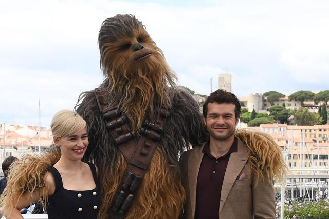 (FromL) British actress Emilia Clarke, Chewbacca and US actor Alden Ehrenreich pose on May 15, 2018 during a photocall for the film Solo : A Star Wars Story at the 71st edition of the Cannes Film Festival. (AFP) (FromL) British actress Emilia Clarke, Chewbacca and US actor Alden Ehrenreich pose on May 15, 2018 during a photocall for the film Solo : A Star Wars Story at the 71st edition of the Cannes Film Festival. (AFP)
