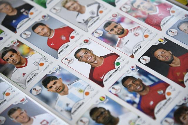 This photo taken on April 20, 2018 shows a collectible card of Portugals forward Cristiano Ronaldo (C) among other collectible cards of football players for the 2018 Russia football World Cup at the Panini Group factory in Modena, northern Italy. The Panini Group holds the rights for the collectible cards of 2018 Russia football World Cup. (AFP) This photo taken on April 20, 2018 shows a collectible card of Portugals forward Cristiano Ronaldo (C) among other collectible cards of football players for the 2018 Russia football World Cup at the Panini Group factory in Modena, northern Italy. The Panini Group holds the rights for the collectible cards of 2018 Russia football World Cup. (AFP)