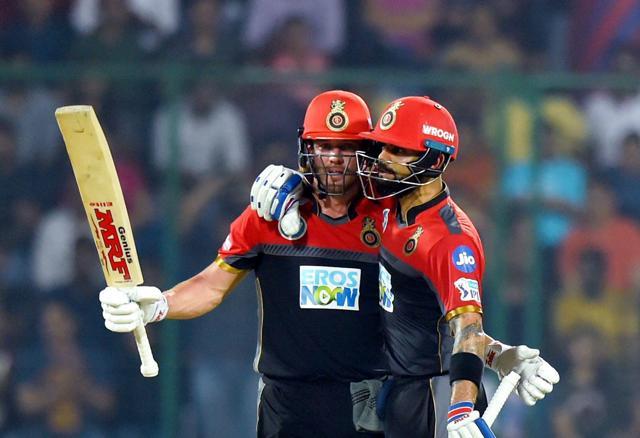 Royal Challengers Bangalore AB de Villiers celebrates his fifty runs with captain Virat Kohli during their IPL 2018 cricket match against Delhi Daredevils' at Feroz Shah Kotla in New Delhi on May 12, 2018. (PTI) Royal Challengers Bangalore AB de Villiers celebrates his fifty runs with captain Virat Kohli during their IPL 2018 cricket match against Delhi Daredevils' at Feroz Shah Kotla in New Delhi on May 12, 2018. (PTI)