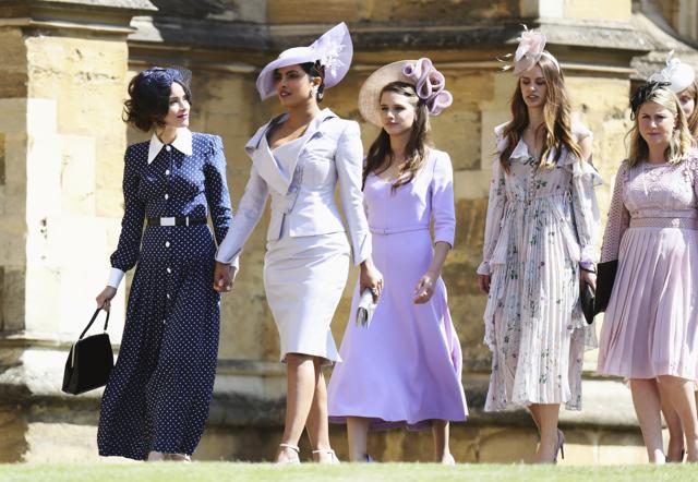 Abigail Spencer, foreground left and Priyanka Chopra arrive for the wedding ceremony of Prince Harry and Meghan Markle at St. Georges Chapel in Windsor Castle in Windsor, near London, England. (AP) Abigail Spencer, foreground left and Priyanka Chopra arrive for the wedding ceremony of Prince Harry and Meghan Markle at St. Georges Chapel in Windsor Castle in Windsor, near London, England. (AP)