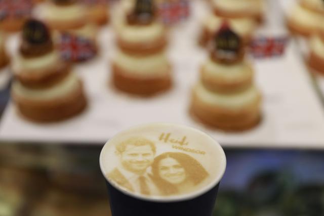 A picture shows a 'Megharryccino', a Royal Wedding-themed coffee decorated with the faces of Britain's Prince Harryand Meghan Markle, in a coffee shop in Windsor on May 18, 2018. (AFP) A picture shows a 'Megharryccino', a Royal Wedding-themed coffee decorated with the faces of Britain's Prince Harryand Meghan Markle, in a coffee shop in Windsor on May 18, 2018. (AFP)
