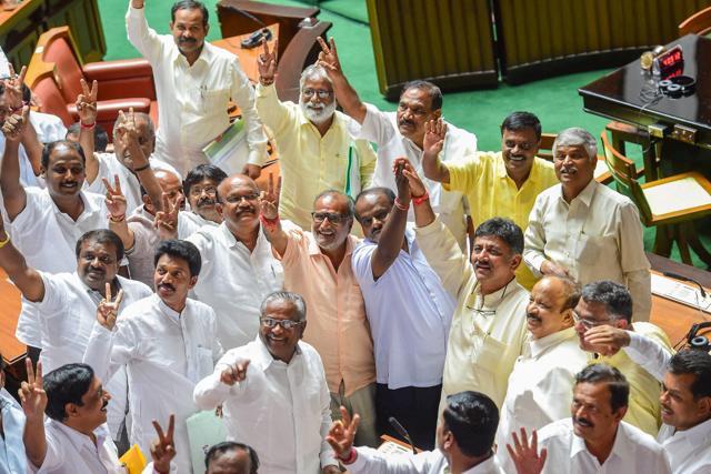 JD(S) leader HD Kumaraswamy and party MLAs show victory sign to celebrate after BS Yediyurappa announced his resignation before the floor test, at Vidhana Soudha in Bengaluru. (PTI Photo) JD(S) leader HD Kumaraswamy and party MLAs show victory sign to celebrate after BS Yediyurappa announced his resignation before the floor test, at Vidhana Soudha in Bengaluru. (PTI Photo)
