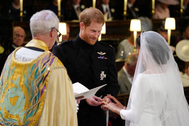 Prince Harry places the wedding ring on the finger of Meghan Markle in St George's Chapel at Windsor Castle during their wedding service, conducted by the Archbishop of Canterbury Justin Welby in Windsor, Britain, May 19, 2018. (REUTERS) Prince Harry places the wedding ring on the finger of Meghan Markle in St George's Chapel at Windsor Castle during their wedding service, conducted by the Archbishop of Canterbury Justin Welby in Windsor, Britain, May 19, 2018. (REUTERS)