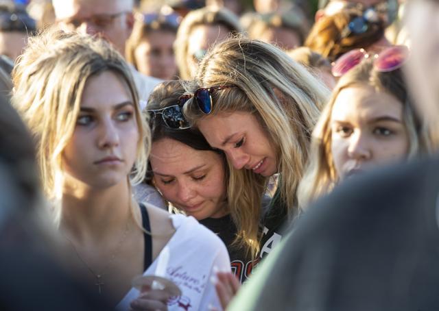 Women embrace during a prayer vigil following a shooting at Santa Fe High School in Santa Fe, Texas. (AP) Women embrace during a prayer vigil following a shooting at Santa Fe High School in Santa Fe, Texas. (AP)