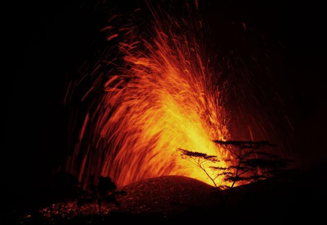 A lava fountain from a Kilauea volcano fissure erupts, while forming a new cone, on Hawaii's Big Island on May 18. (AFP Photo) A lava fountain from a Kilauea volcano fissure erupts, while forming a new cone, on Hawaii's Big Island on May 18. (AFP Photo)