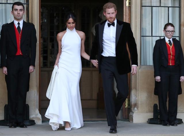 The newly married Duke and Duchess of Sussex, Meghan Markle and Prince Harry, leaving Windsor Castle after their wedding to attend an evening reception at Frogmore House, hosted by the Prince of Windsor. (REUTERS) The newly married Duke and Duchess of Sussex, Meghan Markle and Prince Harry, leaving Windsor Castle after their wedding to attend an evening reception at Frogmore House, hosted by the Prince of Windsor. (REUTERS)