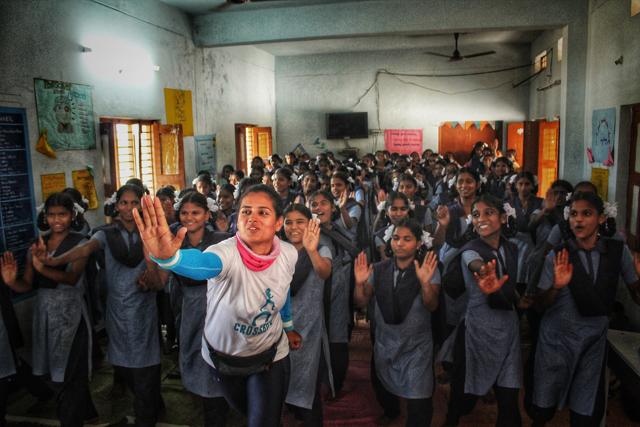 Srishti educates girl during a workshop.