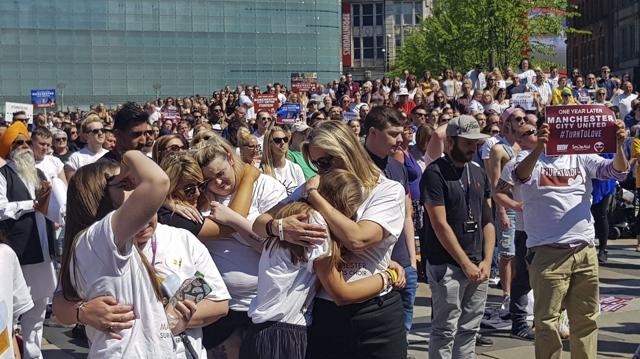 Members of the public observe a minute's silence in Cathedral Gardens, during the Manchester Arena National Service of Commemoration at Manchester Cathedral, in Manchester, England, Tuesday May 22, 2018. (AP) Members of the public observe a minute's silence in Cathedral Gardens, during the Manchester Arena National Service of Commemoration at Manchester Cathedral, in Manchester, England, Tuesday May 22, 2018. (AP)