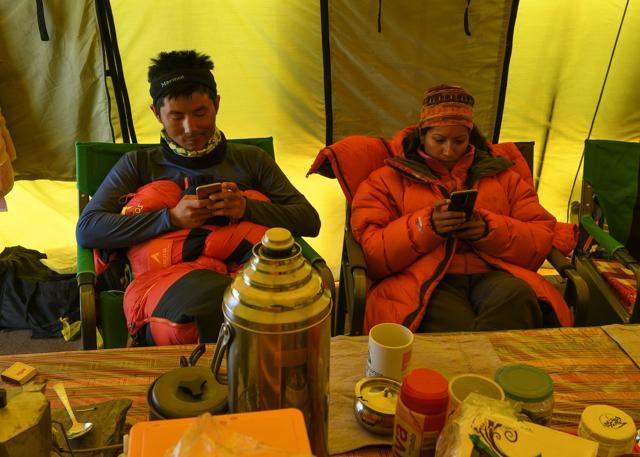 Climbers use their mobile phones at Everest base camp, near Kathmandu. Gone are the days of deprivation at Everest base camp, with hipster perks and access to conveniences ensuring life is cushier than ever on the roof of the world. (AFP) Climbers use their mobile phones at Everest base camp, near Kathmandu. Gone are the days of deprivation at Everest base camp, with hipster perks and access to conveniences ensuring life is cushier than ever on the roof of the world. (AFP)