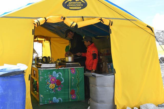 A chef at New Zealand-based Adventure Consultants, cooks food in a tent kitchen at Everest base camp, some 140 kilometres northeast of Kathmandu. (AFP) A chef at New Zealand-based Adventure Consultants, cooks food in a tent kitchen at Everest base camp, some 140 kilometres northeast of Kathmandu. (AFP)