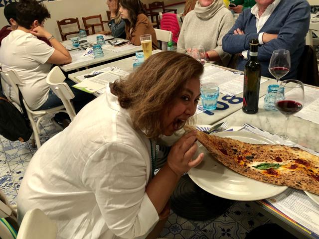 Karen enjoying a simple pizza in Naples