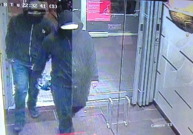 Security footage shows the suspects, dressed in dark hoodies, enter the restaurant. Police posted the image on Twitter asking for people’s help in identifying the suspects. (Peel Regional Police/Twitter) Security footage shows the suspects, dressed in dark hoodies, enter the restaurant. Police posted the image on Twitter asking for people’s help in identifying the suspects. (Peel Regional Police/Twitter)