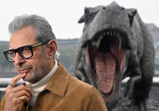 Cast member Jeff Goldblum conducts an interview near a model dinosaur during a photocall to promote the forthcoming film Jurassic World: Fallen Kingdom in London. (REUTERS) Cast member Jeff Goldblum conducts an interview near a model dinosaur during a photocall to promote the forthcoming film Jurassic World: Fallen Kingdom in London. (REUTERS)