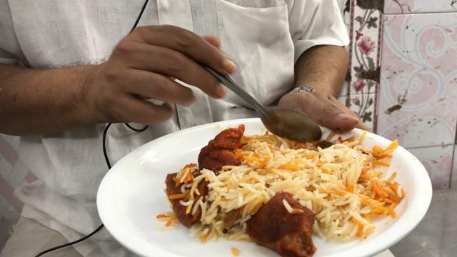 The biryani was served with some raita – which was hot and meant to complement the mildness of the biryani – and pickle. (HT photo) The biryani was served with some raita – which was hot and meant to complement the mildness of the biryani – and pickle. (HT photo)
