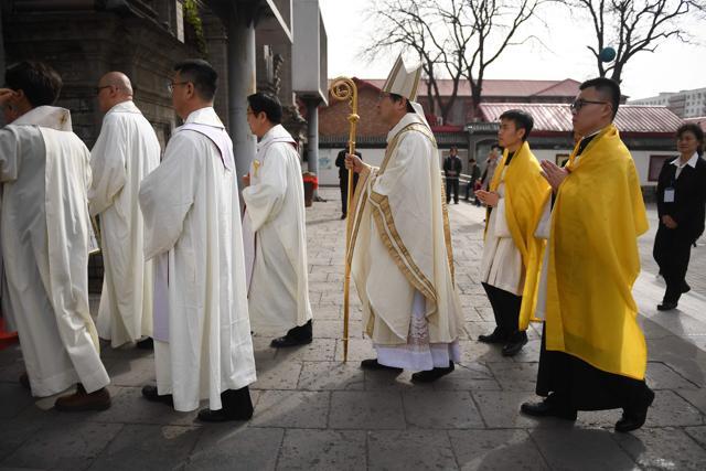Catholic clergy arrive for mass at the government sanctioned South Cathedral in Beijing. (AFP Photo)