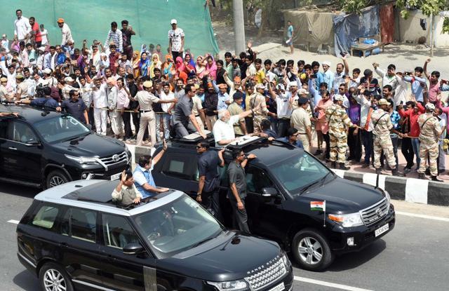 PM Narendra Modi waves to supporters during the roadshow in Delhi. (Picture courtesy: BJP Live/Twitter) PM Narendra Modi waves to supporters during the roadshow in Delhi. (Picture courtesy: BJP Live/Twitter)