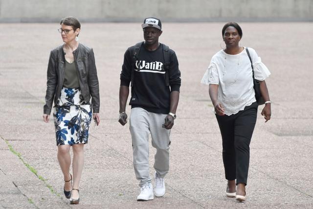 Malian migrant Mamoudou Gassama (centre) arrives to receive a temporary residence permit at the Prefecture of Bobigny, northeast of Paris. (AFP Photo) Malian migrant Mamoudou Gassama (centre) arrives to receive a temporary residence permit at the Prefecture of Bobigny, northeast of Paris. (AFP Photo)