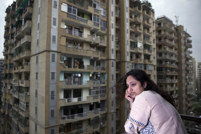 Sajna Nair on the balcony of her home . (Photographer: Ruhani Kaur/Bloomberg) Sajna Nair on the balcony of her home . (Photographer: Ruhani Kaur/Bloomberg)