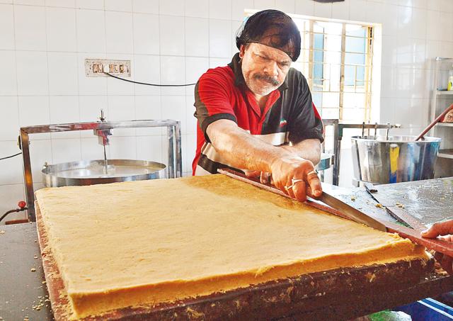 A worker makes makha sandesh at Balaram Mullick A worker makes makha sandesh at Balaram Mullick