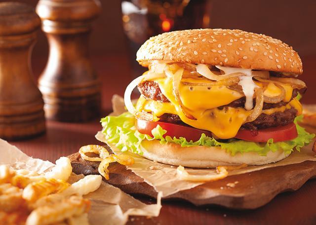 A slice of cheese is an essential part of a cheese burger (Shutterstock)