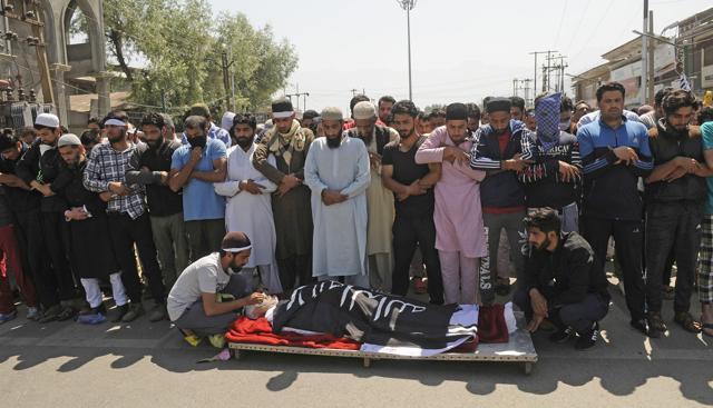 People offer funeral prayers during the funeral procession of Kaiser Ahmad in downtown Srinagar on June 2. (Waseem Andrabi/ Ht Photo) People offer funeral prayers during the funeral procession of Kaiser Ahmad in downtown Srinagar on June 2. (Waseem Andrabi/ Ht Photo)