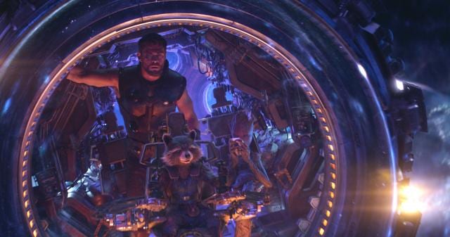 This image released by Marvel Studios shows Chris Hemsworth as Thor. with characters Rocket, voiced by Bradley Cooper, seated center, and Groot, voiced by Vin Diesel, in a scene from Avengers: Infinity War. (Marvel Studios via AP) (AP)