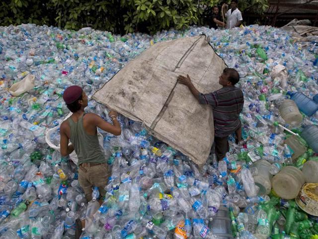 Workers sort bottles at recycling workshop in Mumbai. (Reuters File Photo) Workers sort bottles at recycling workshop in Mumbai. (Reuters File Photo)