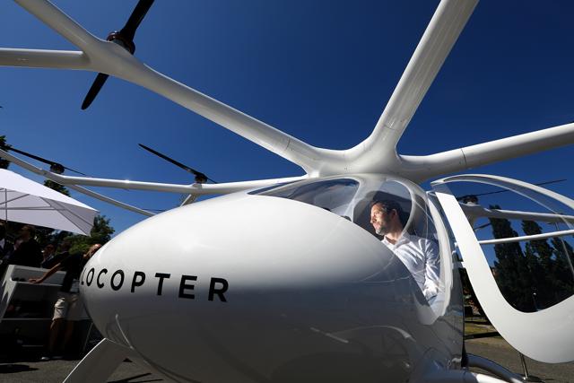Florian Reuter, chief executive officer of Volocopter GmbH, poses for a photograph in the cockpit of a Volocopter 2X multi-rotor electric helicopter at the Noah Technology Conference in Berlin, Germany. (Krisztian Bocsi/Bloomberg) Florian Reuter, chief executive officer of Volocopter GmbH, poses for a photograph in the cockpit of a Volocopter 2X multi-rotor electric helicopter at the Noah Technology Conference in Berlin, Germany. (Krisztian Bocsi/Bloomberg)