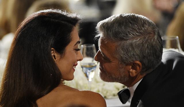 Actor/director George Clooney, right, and his wife and human rights lawyer Amal mingle during the 46th AFI Life Achievement Award gala ceremony honoring him at the Dolby Theatre, Thursday, June 7, 2018, in Los Angeles. (Chris Pizzello/Invision/AP) Actor/director George Clooney, right, and his wife and human rights lawyer Amal mingle during the 46th AFI Life Achievement Award gala ceremony honoring him at the Dolby Theatre, Thursday, June 7, 2018, in Los Angeles. (Chris Pizzello/Invision/AP)