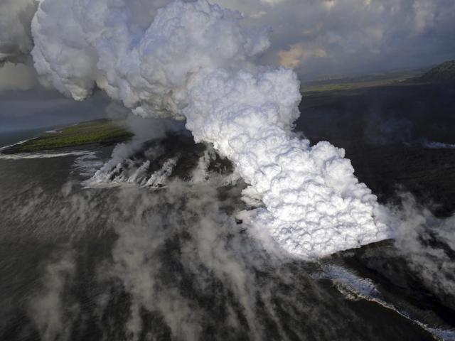 Lava haze plume rising from the northern side of the fissure 8 lava flow margins in the former Kapoho Bay at the town of Kapoho on the island of Hawaii. (AP Photo) Lava haze plume rising from the northern side of the fissure 8 lava flow margins in the former Kapoho Bay at the town of Kapoho on the island of Hawaii. (AP Photo)