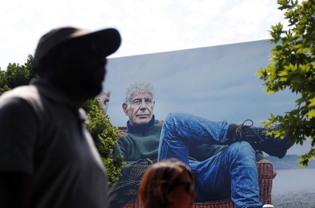 People walk past a billboard for the CNN television show "Parts Unknown" with American celebrity chef Anthony Bourdain in Atlanta on June 8. (AP Photo) People walk past a billboard for the CNN television show "Parts Unknown" with American celebrity chef Anthony Bourdain in Atlanta on June 8. (AP Photo)